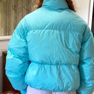 Bright blue, never worn puffer jacket